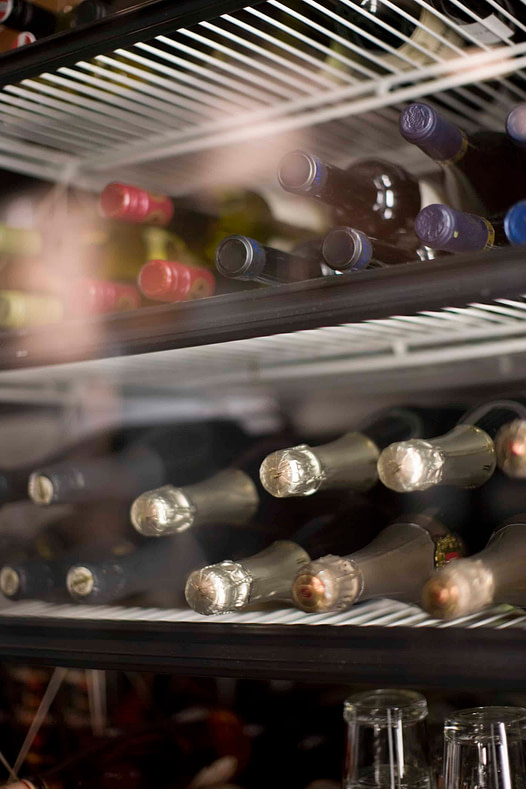 Wine and champagne in refrigerator